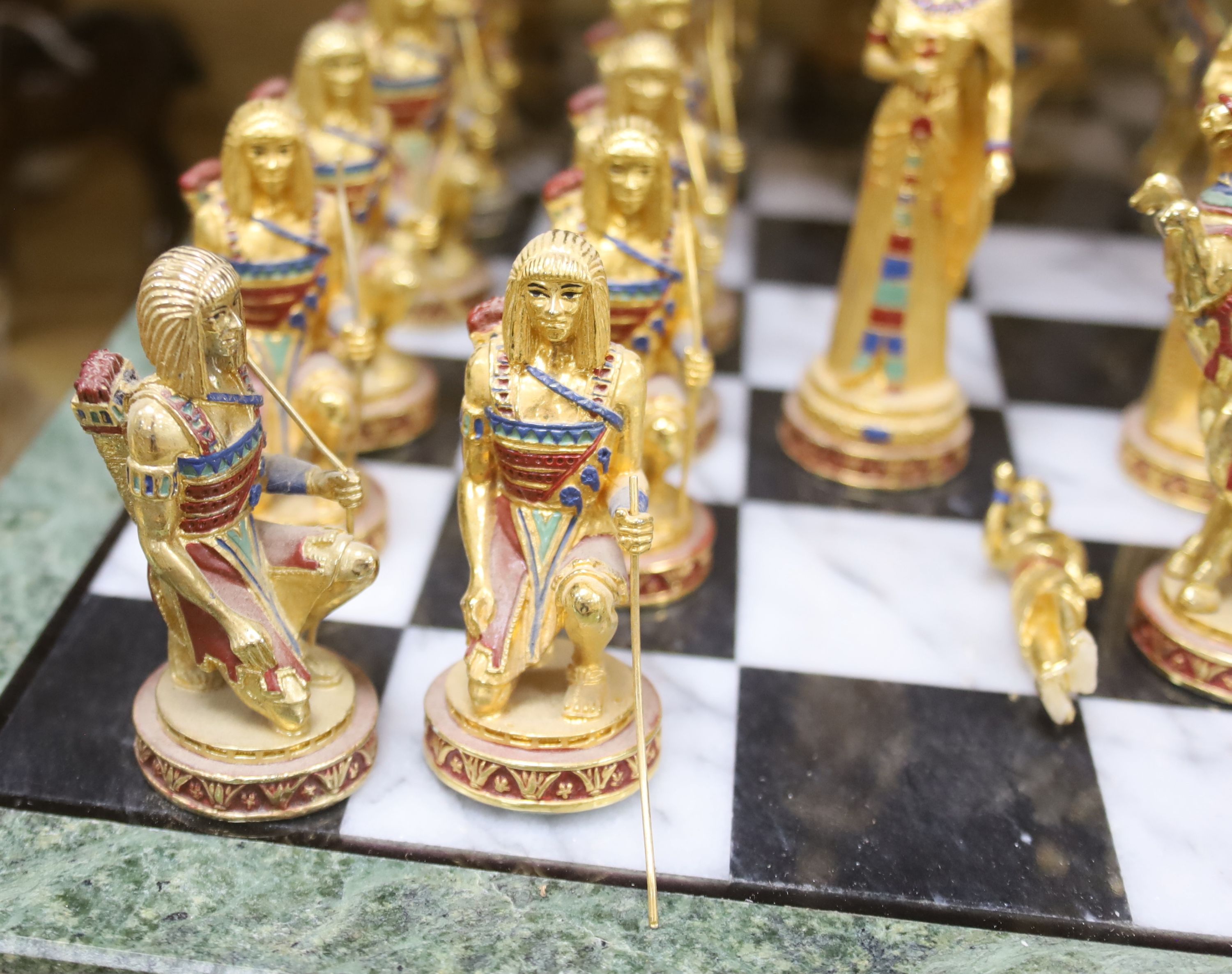 A contemporary chess board and pieces, Egyptian theme